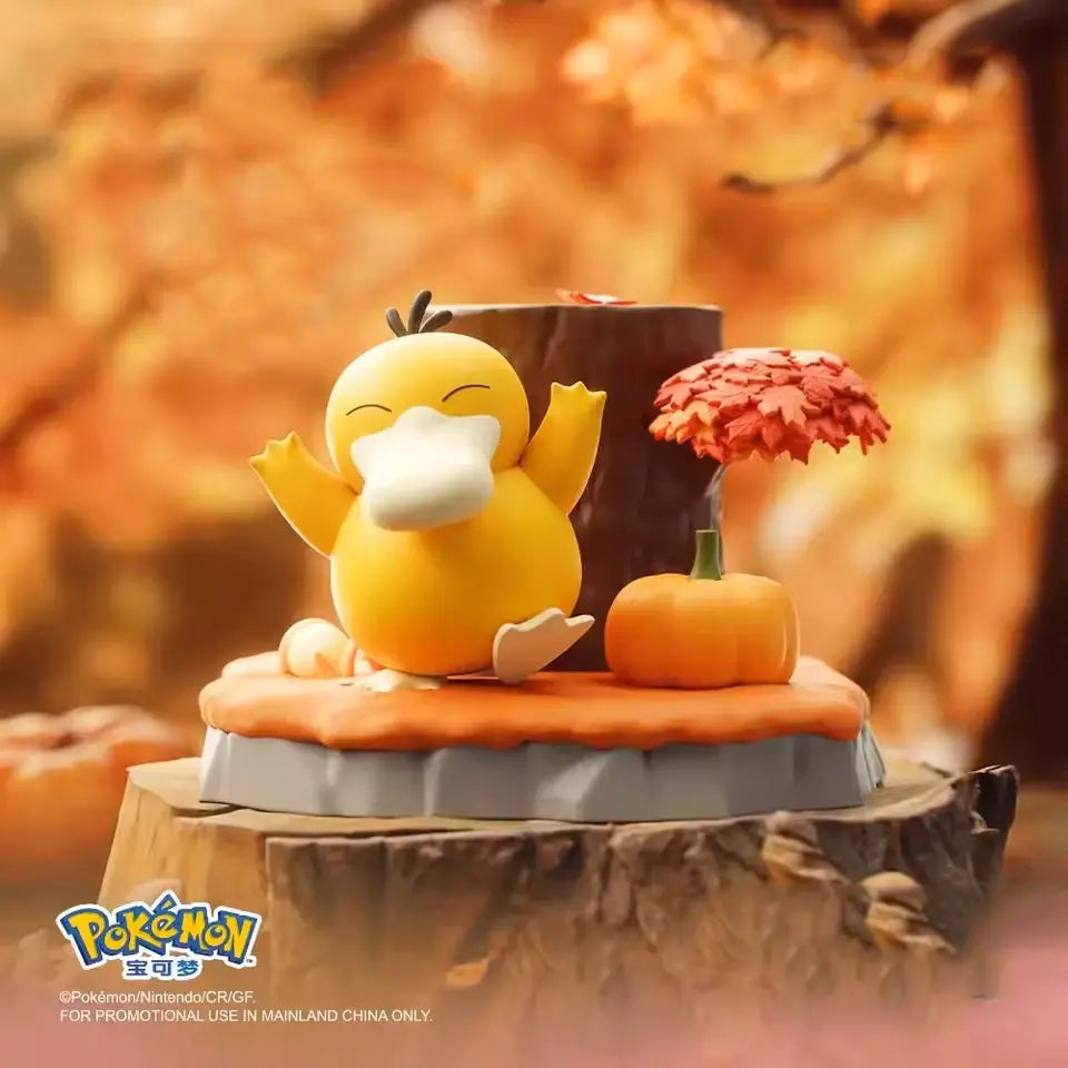 Adorable Pokémon Figures collection featuring a cheerful Psyduck on a scenic display with autumn elements.
