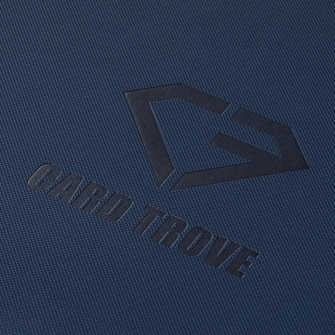 Close-up of the 12-Pocket Card Binder Blue featuring the Card Trove logo on a textured blue surface.