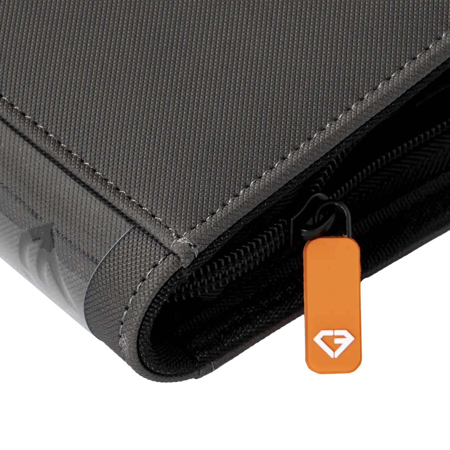 4-Pocket Card Binder Grey close-up showing durable surface, smooth zipper, and branding tag.