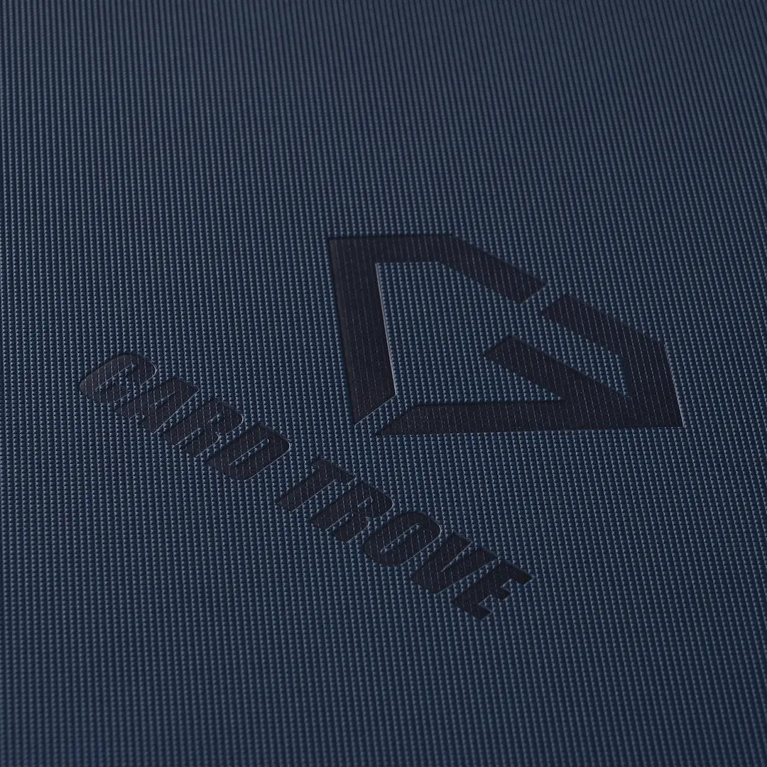9-Pocket Toploader Card Binder Blue close-up showing texture and logo for quality card storage.