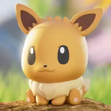Pokémon Mini Figure Blind Box featuring a cute Eevee mini figurine sitting on a wooden surface.