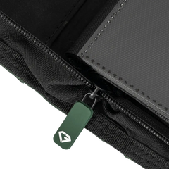 Close-up view of the zipper and compartments of the 12-Pocket XL Card Binder Green for secure card storage.