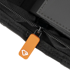 Close-up of the zipper on the 12 Pocket XL Card Binder, featuring a vibrant orange pull tab.