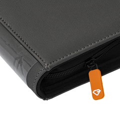 Close-up of the 9 Pocket Card Binder in gray with a smooth zipper and orange pull tab.