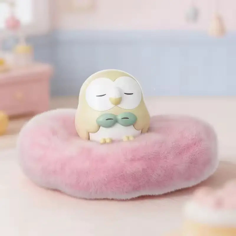 Pokémon: Poképeace Napping Figures Blind Box (Holly Box) featuring a sleepy owl figure on a fluffy cushion.