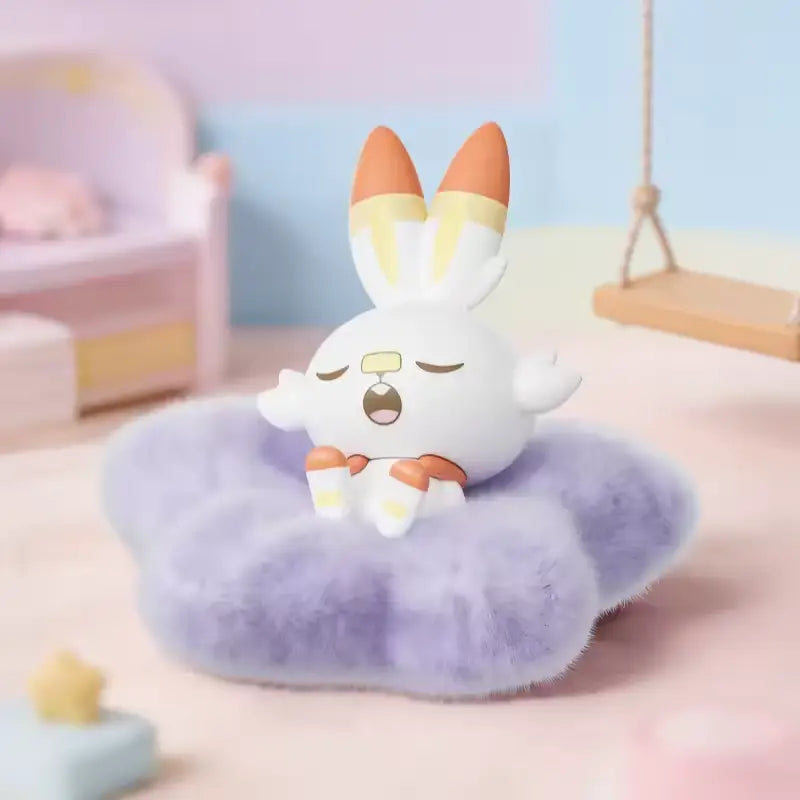 Pokémon: Poképeace Napping Figures Blind Box (Holly Box) of a sleeping bunny character on a fluffy purple pillow.
